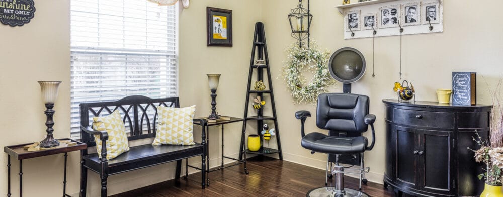 Cozy salon area with styling chair and decor