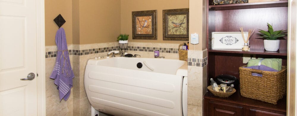 Brightly decorated bathroom with accessible tub