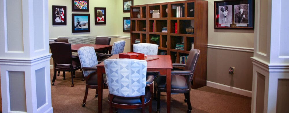 Interior space with tables and framed photos