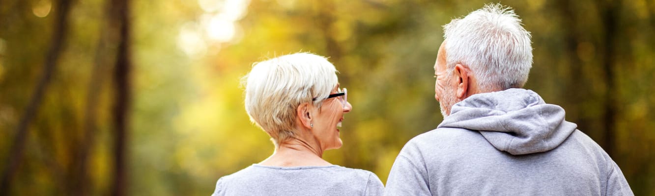 Couple walking in a serene outdoor setting