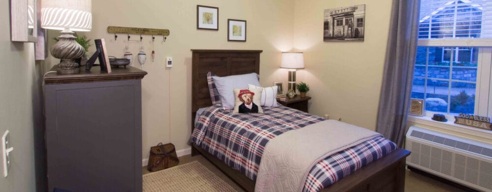 Cozy resident bedroom with earthy decor and a bed