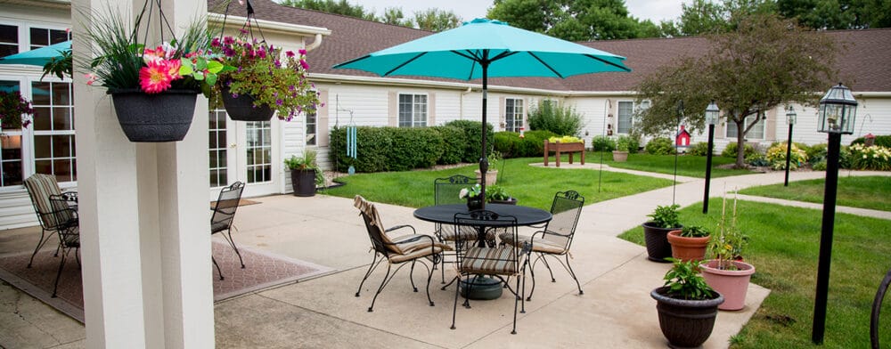 Outdoor patio area with tables and umbrellas