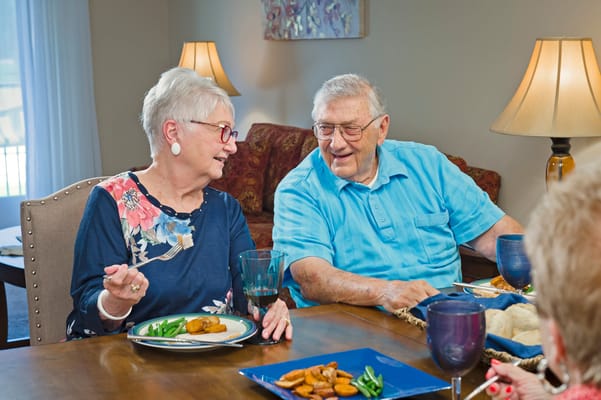 Residents enjoying a meal in a dining area