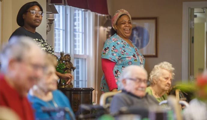 Happy residents and staff engaging in activities