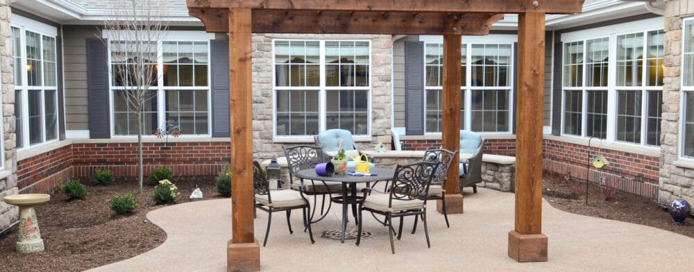 Outdoor seating area with tables and chairs in a courtyard