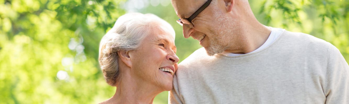 Happy elderly couple enjoying time outdoors