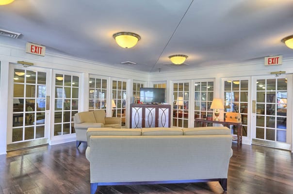 Interior common area with seating and exit signs