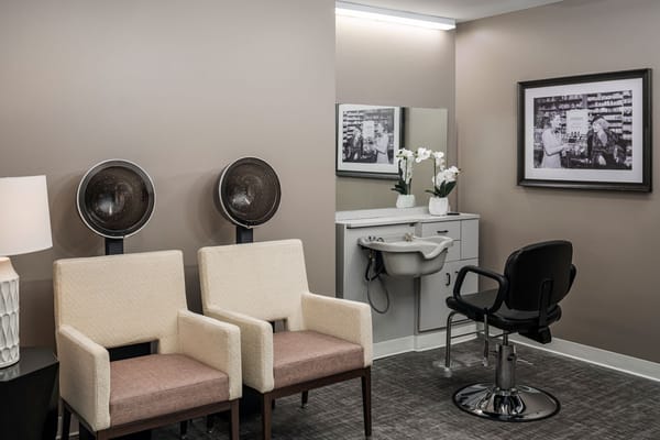 Interior view of a hair salon area with styling chairs