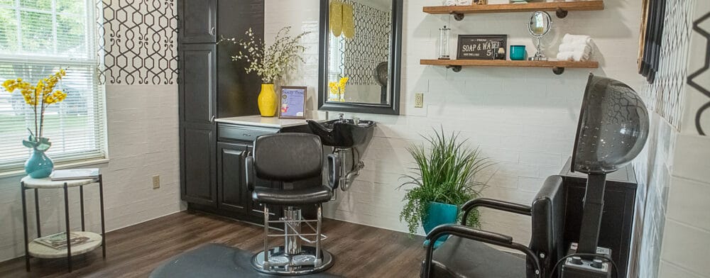 Hair salon area with styling chairs and decor