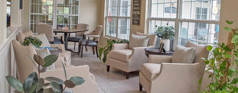 Bright common area with comfortable seating and plants