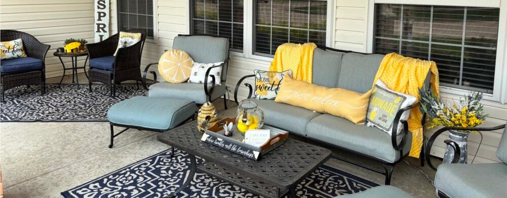 Outdoor seating area with cozy furniture and decorations