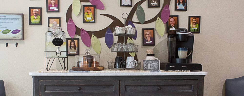 Coffee station with decorative wall and resident photos