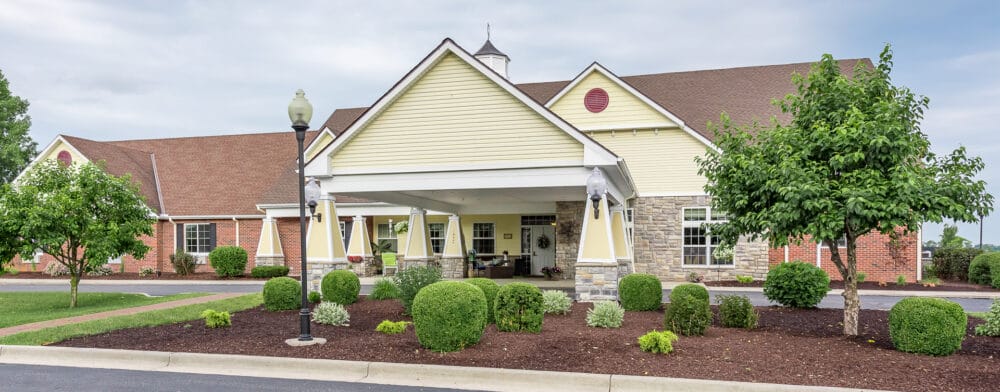 Exterior view of Bickford of Saginaw Township building with landscaping