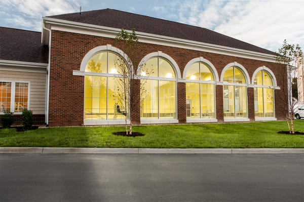 Exterior view of a senior living facility with large windows