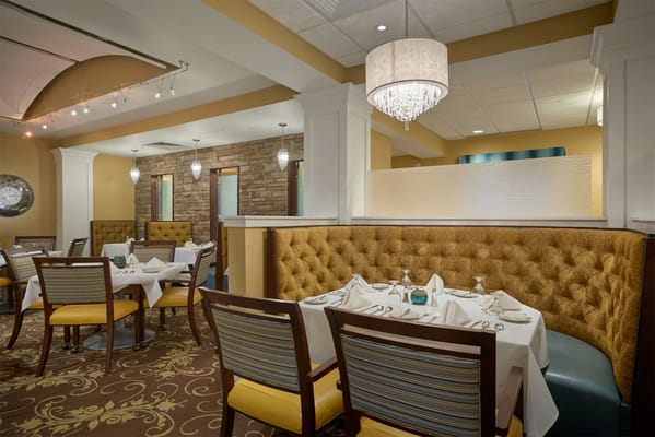Elegant dining area with tables set for a meal