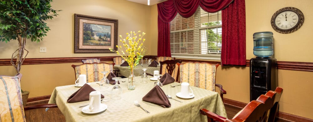 Dining room setting with tables set for meals