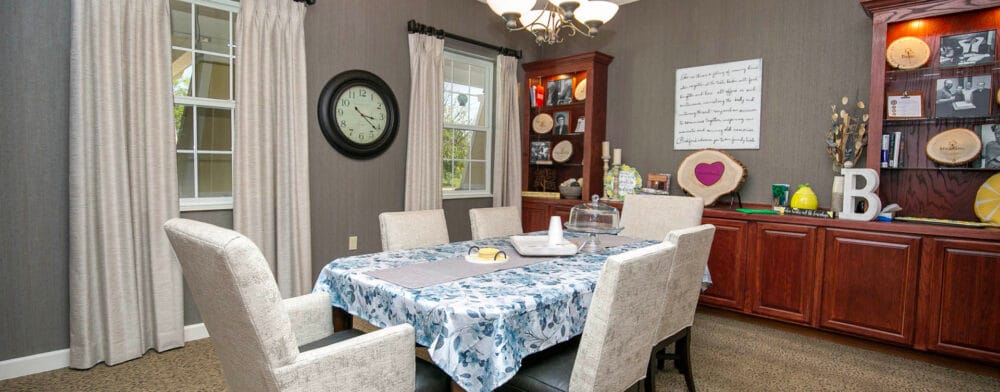 Bright dining area with a patterned tablecloth and decor