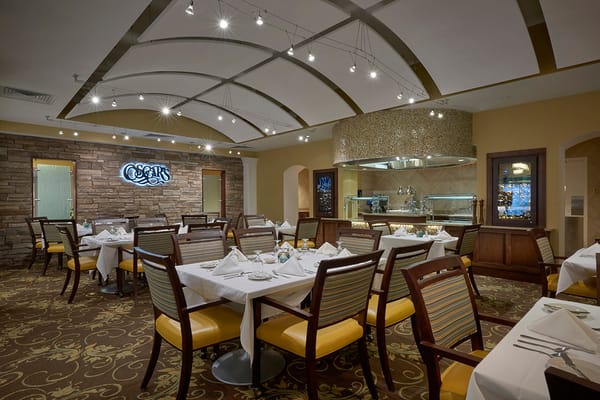 Elegant dining area with tables set for a meal