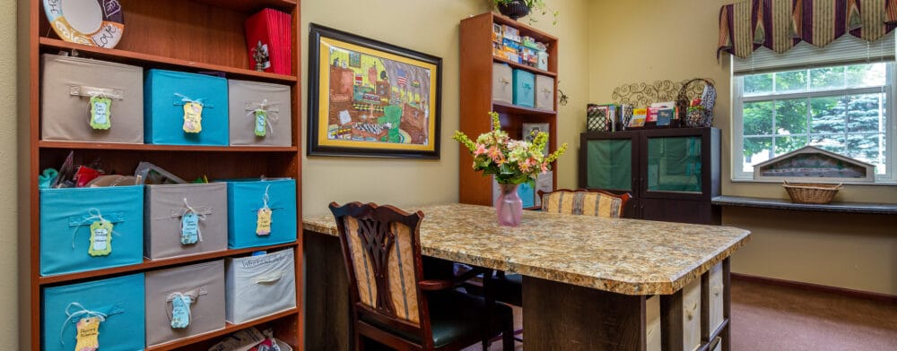 Bright and colorful activity room in a senior care facility.
