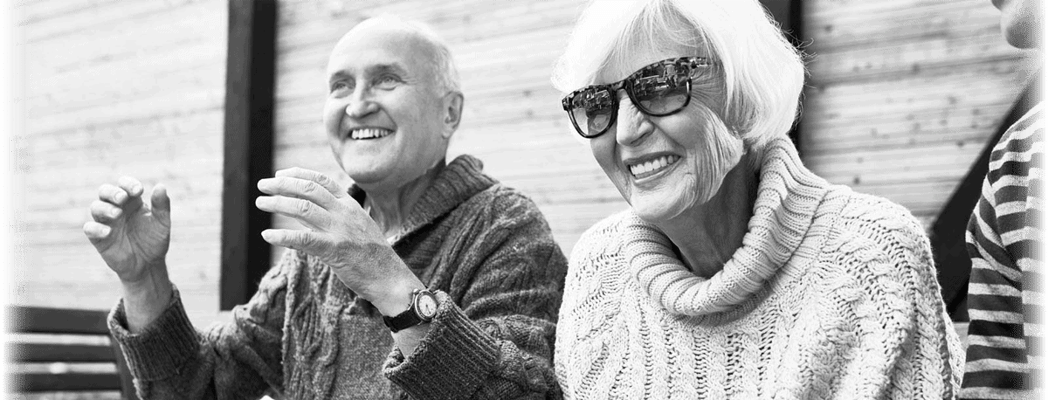 Two seniors enjoying a conversation outdoors