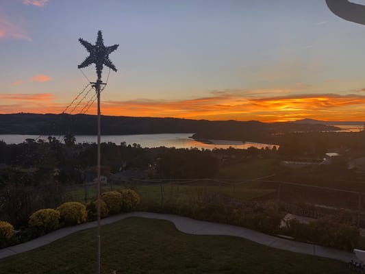 Sunset view over a serene landscape with water