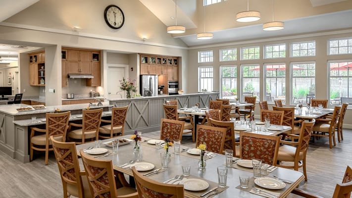 Bright dining area with tables and flowers