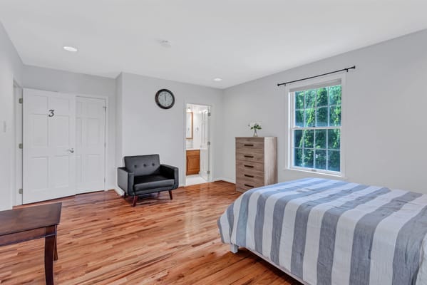 Interior view of a private resident room with furniture