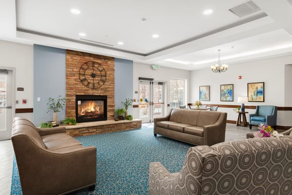 Bright and inviting common area with a cozy fireplace
