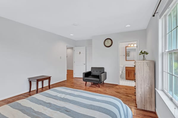 Bright, spacious resident room with wooden flooring