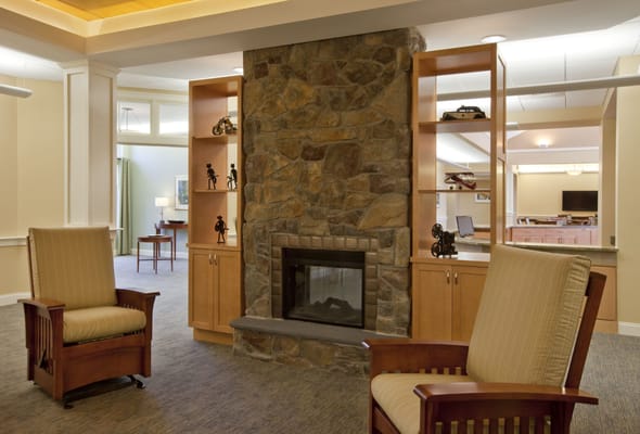 Interior view of a cozy common area with fireplace