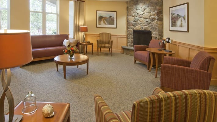 Cozy common area with seating and a fireplace