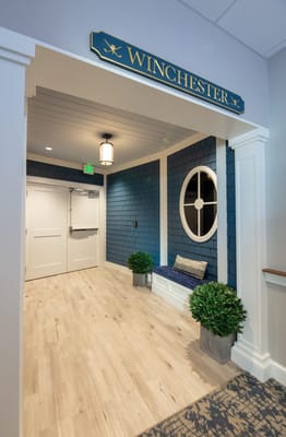 Interior hallway with seating and plant decorations