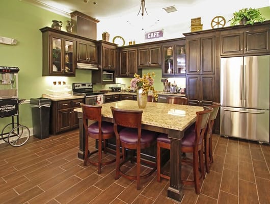 Bright kitchen area with an island and seating