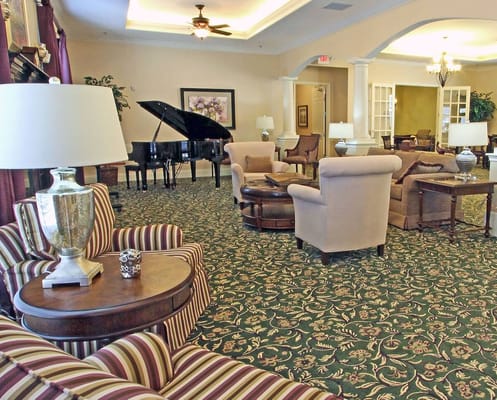 Elegant common area with seating and a piano