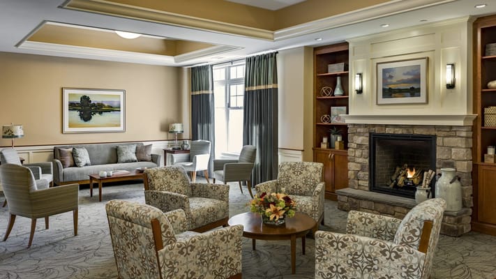 Common area with comfortable seating and a fireplace