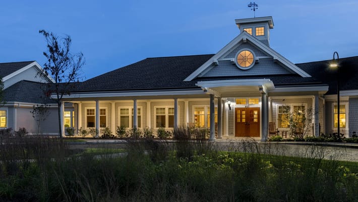 Exterior view of a senior living facility at dusk