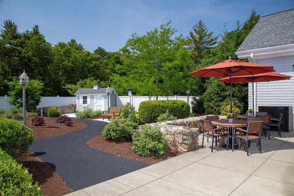 Outdoor garden area with seating and pathways