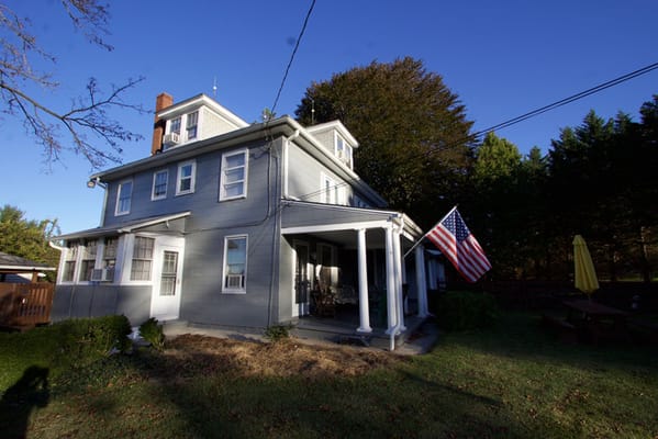 Exterior view of the assisted living facility with American flag