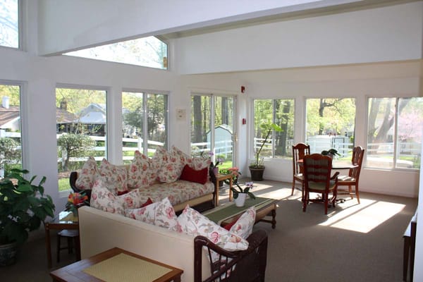 Bright common area with seating and natural light