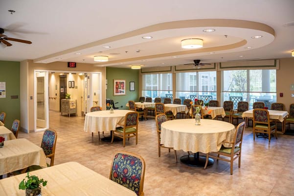 Bright dining room with tables and chairs