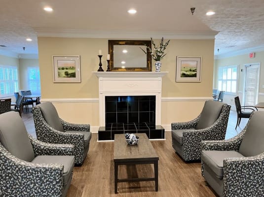 Common area with comfortable seating near a fireplace
