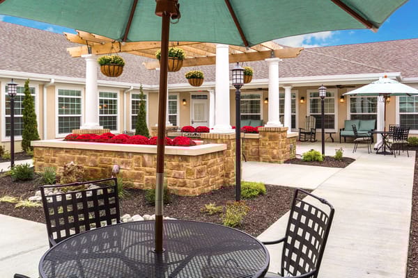 Outdoor garden area with seating and flowers