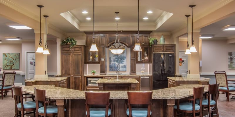 A well-lit interior kitchen area with seating