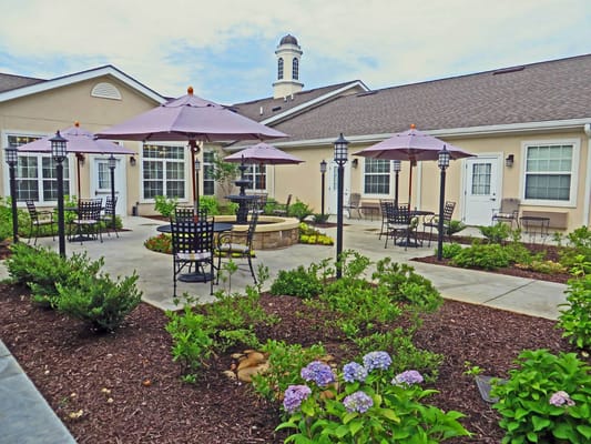 Outdoor patio area with tables and umbrellas