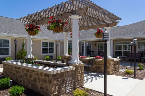 Outdoor area with a pergola and flower planters
