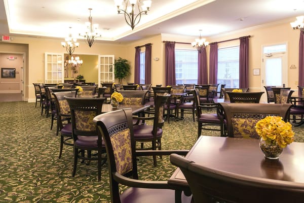 Bright dining room filled with tables and chairs