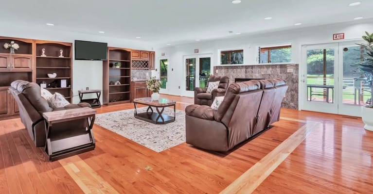 Bright common area with comfortable seating and natural light