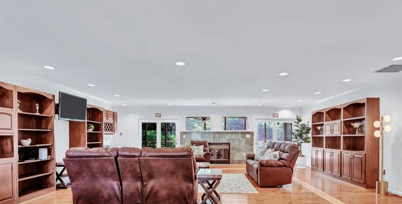 Bright and spacious common area with seating and shelves