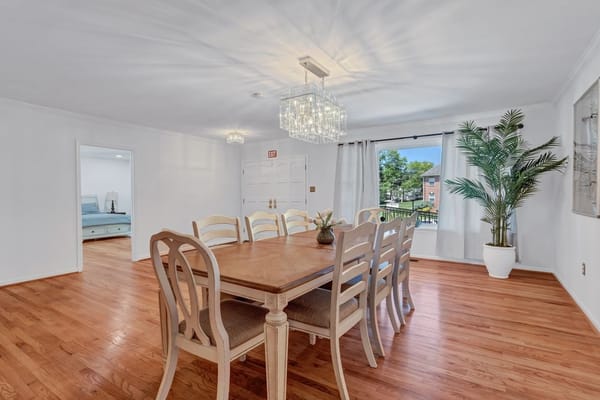 Bright dining area with a wooden table and chairs