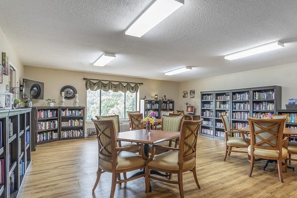 Interior view of a common area with bookshelves and seating